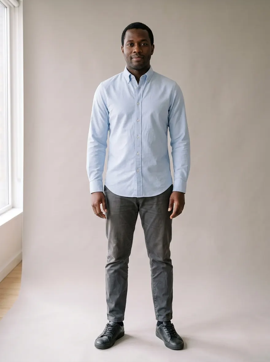 AI try-on example: man in a pale blue slim-fit oxford shirt with gray chinos